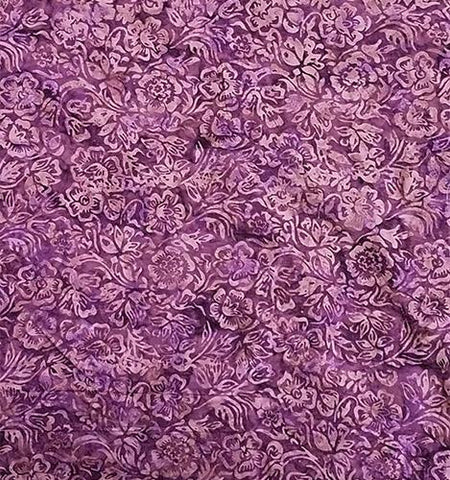 A purple tonal fabric featuring  large flowers. Available at Colorado Creations Quilting