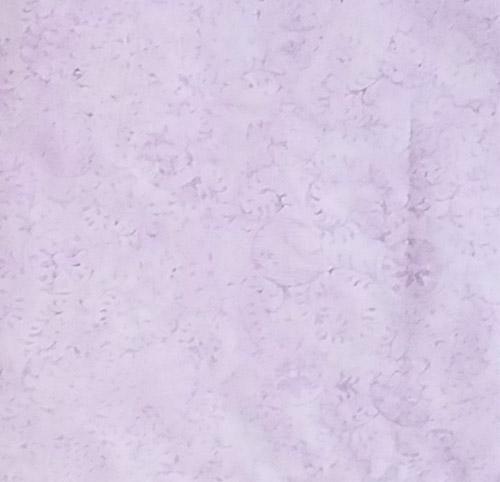 This pale tonal light purple batik cotton fabrics with vines and circular patterns with a floral image in the center