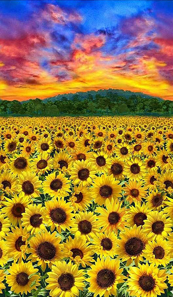 This fabric panel features a filed of sunflowers in multiple sizes under a vibrant sunset sky.