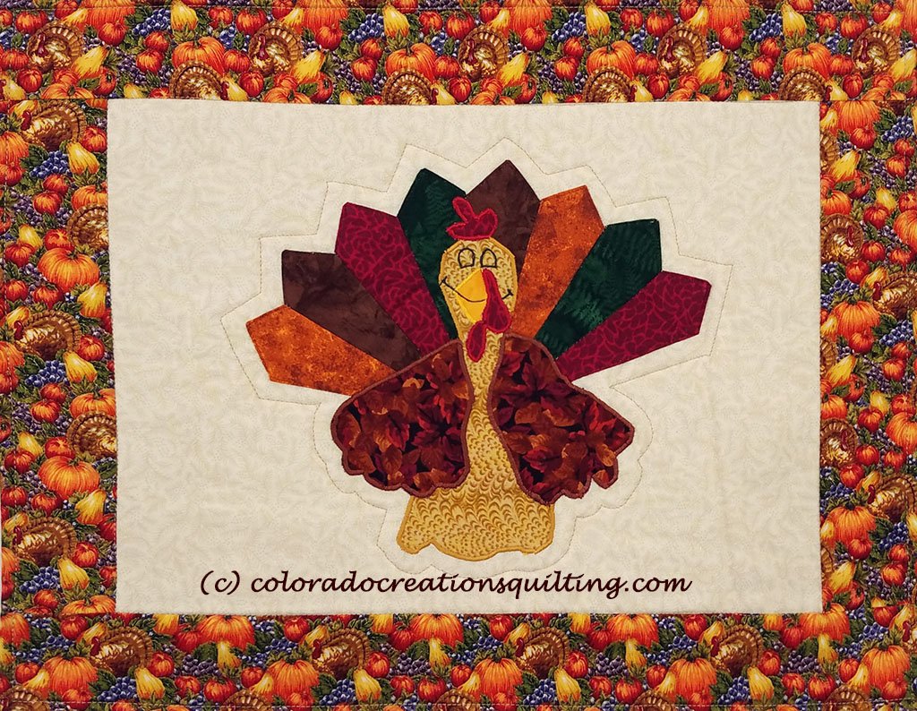 Appliqued turkey on cream colored placemats