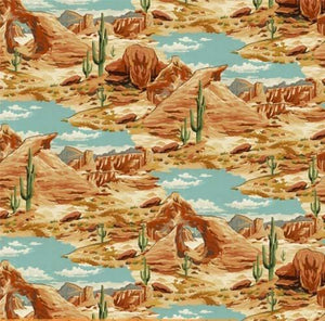 This cotton fabric features red rock formations and arches underneath a bright blue sky complete with a few saguaro cacti sprinkled throughout. Available at Colorado Creations Quilting