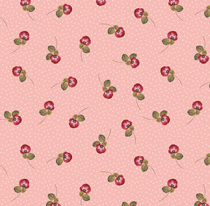 This cotton fabric features single red roses on a pink background. Available at Colorado Creations Quilting