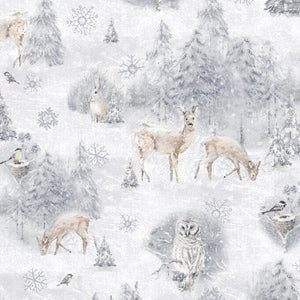 This cotton fabric features snow-covered trees, deer, rabbits and snowy owls. Available at Colorado Creations Quilting