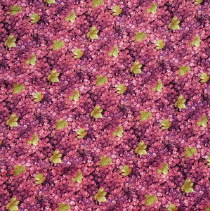 This cotton fabric features purple grapes with a few green grape leaves.